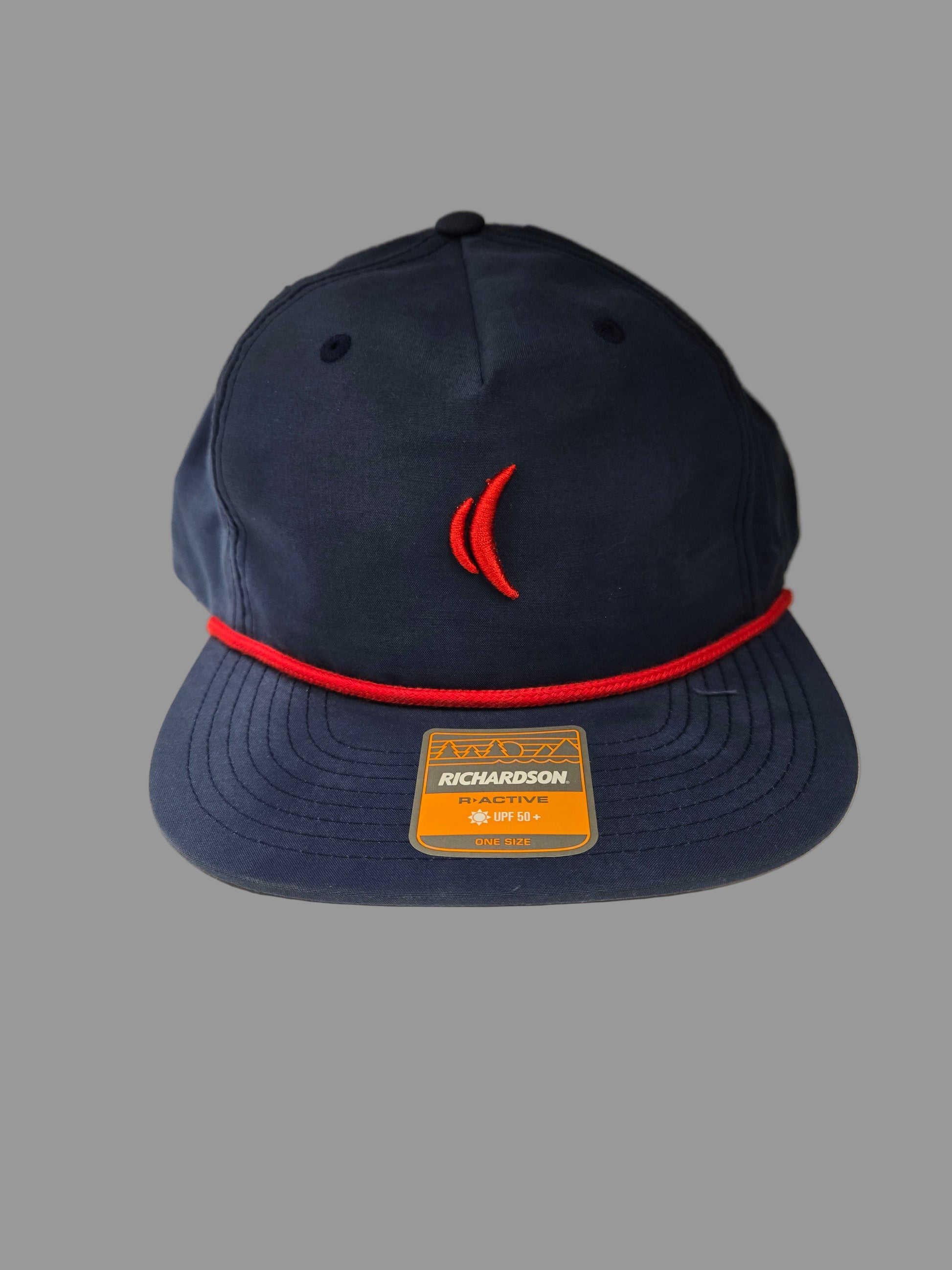 Navy blue cap with red brim and visible brand logo on a neutral background
